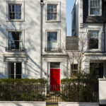 front-view-front-door-with-white-wall-plants